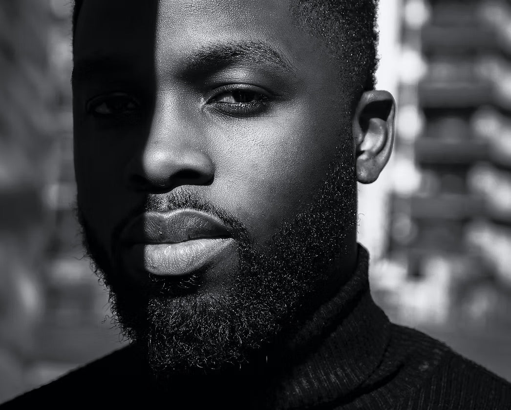 Black and white portrait of a man with a blurred background